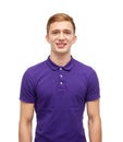 Smiling young man in purple polo t-shirt Royalty Free Stock Photo