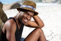 Smiling young man relaxing at the beach Royalty Free Stock Photo