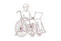 Smiling man in wheelchair work on computer