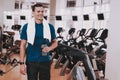 Smiling Young Man in Sport Club near Treadmills. Royalty Free Stock Photo