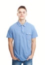 Smiling young man standing with hands in pockets Royalty Free Stock Photo