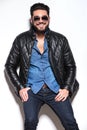 Smiling young man in sunglasses and leather jacket Royalty Free Stock Photo