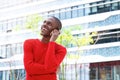 Smiling young man talking on mobile phone in the city Royalty Free Stock Photo