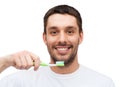 Smiling young man with toothbrush Royalty Free Stock Photo