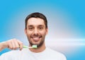 Smiling young man with toothbrush Royalty Free Stock Photo