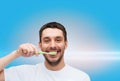 Smiling young man with toothbrush Royalty Free Stock Photo