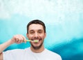 Smiling young man with toothbrush Royalty Free Stock Photo