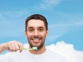 Smiling young man with toothbrush Royalty Free Stock Photo