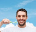 Smiling young man with toothbrush Royalty Free Stock Photo