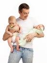 Smiling young man with two baby boys over white Royalty Free Stock Photo