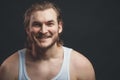 Smiling young man wearing white undershirt Royalty Free Stock Photo