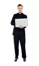 Smiling young man working on laptop Royalty Free Stock Photo
