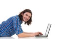 Smiling young man working on a laptop. Royalty Free Stock Photo