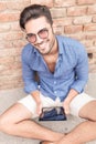 Smiling young man working on a tablet computer Royalty Free Stock Photo