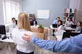 Manager Welcoming New Employee Introducing Her To Colleagues