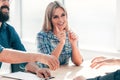 Smiling young man answering employers ` questions during the interview Royalty Free Stock Photo