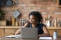 Smiling young mixed race woman dictating audio message. Royalty Free Stock Photo