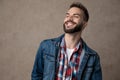 Smiling young model wearing blue denim jacket Royalty Free Stock Photo