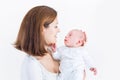 Smiling young mother holding her newborn baby Royalty Free Stock Photo