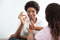 Deaf Mother Talking Sign Language With Her Daughter