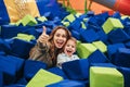 Smiling young mother playing with her little son Royalty Free Stock Photo