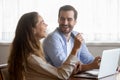 Happy millennial couple have fun using laptop at home Royalty Free Stock Photo