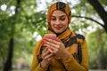 Young Muslim woman using smart phone. Royalty Free Stock Photo