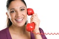 Smiling young operator with red phone Royalty Free Stock Photo