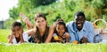 Parents with daughter and son lying on grass Royalty Free Stock Photo