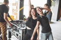 Smiling young people playing table football while indoors Royalty Free Stock Photo