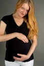 Smiling young pregnant blonde Royalty Free Stock Photo