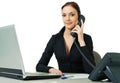 Smiling young receptionist using desk phone Royalty Free Stock Photo