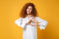 Smiling young redhead woman girl in casual white shirt posing isolated on yellow orange wall background. People Royalty Free Stock Photo