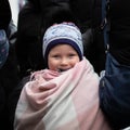 Smiling refugee girl arriving at the Mlyny centre in Poland