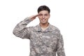 Smiling young soldier saluting Royalty Free Stock Photo