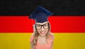 Smiling young student woman in mortarboard Royalty Free Stock Photo