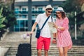 Young travellers couple reading city map and looking for hotel Royalty Free Stock Photo