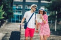 Young travellers couple reading city map and looking for hotel Royalty Free Stock Photo