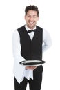 Smiling Young Waiter Holding Empty Serving Tray Royalty Free Stock Photo