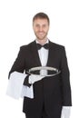 Smiling Young Waiter Holding Empty Serving Tray Royalty Free Stock Photo