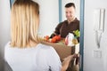 Delivery Man Holding Groceries Royalty Free Stock Photo