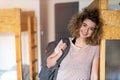 Young woman with backpack at youth hostel Royalty Free Stock Photo