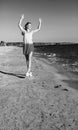 Smiling young woman on beach in evening having fun time Royalty Free Stock Photo