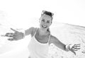 Smiling young woman on beach in evening having fun time Royalty Free Stock Photo