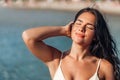 smiling young woman in bikini swimsuit on beach Royalty Free Stock Photo