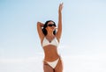 smiling young woman in bikini swimsuit on beach Royalty Free Stock Photo