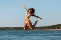 smiling young woman in bikini swimsuit on beach Royalty Free Stock Photo