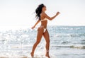 smiling young woman in bikini swimsuit on beach Royalty Free Stock Photo