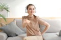 Smiling young woman blogger influencer working at home. Girl talking at web camera, making videochat or conference call Royalty Free Stock Photo