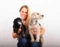 Woman with two dogs on lap Royalty Free Stock Photo